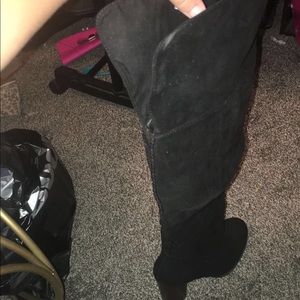 Thigh high black heeled boots